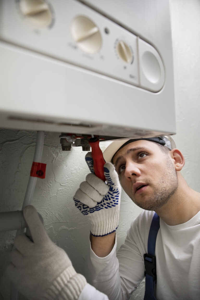 worker repairing water heater 1
